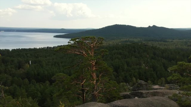 Borovoe lake with green trees, top of the mountains view from the drone
