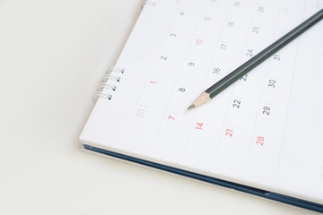 A pencil on the calendar With selectable focus for remark or memo.