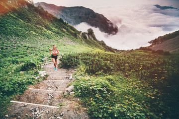 Woman running and jogging in the nature mountain scenery. Concept of healthy lifestyle. Fitness...