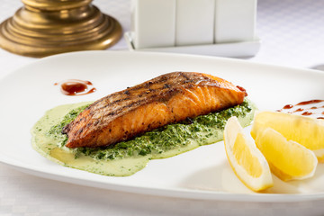 Salmon and spinach sauce, food close-up
