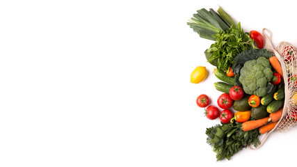 Obraz na płótnie Canvas Fresh and colorful vegetables inside eco bag on white