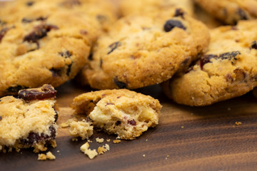 Pile of delicious tasty recipe apple cookies homemade with crack small pieces isolated on wooden table