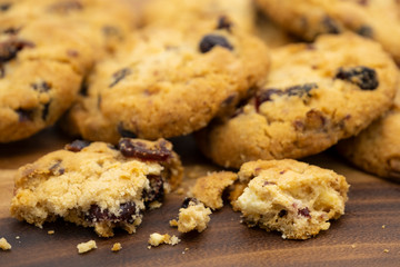 Pile of delicious tasty recipe apple cookies homemade with crack small pieces isolated on wooden table
