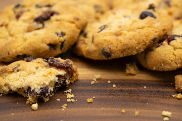 Pile of delicious tasty recipe apple cookies homemade with crack small pieces isolated on wooden table
