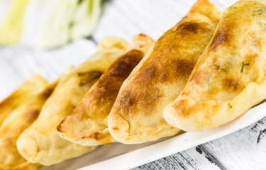 Some fresh made Empanadas (selective focus; close-up shot)