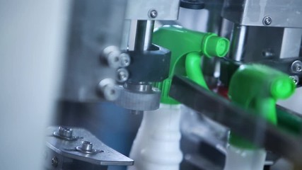 Cleaning Products Manufacturing. Spray Bottles On The Belt Conveyor