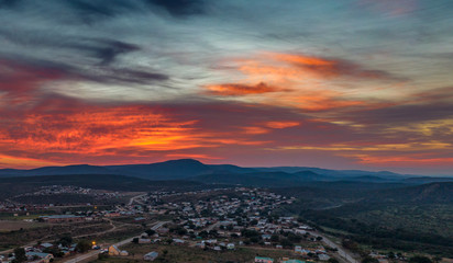 Fototapeta na wymiar Sunrise over the small town of Jansenville in the arid Karoo region of South Africa.