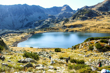 Autumn mountain hiking Bucura lake from Peleaga Peak