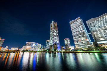 Fototapeta na wymiar city skyline looking up night view in Yokohama