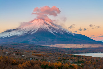 Fuji mountain with red reflective clouds covered the summit in early morning at Panorama-dai , lake Yamanakako.