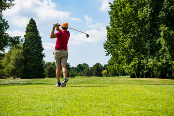 Close up Golfer is driving golf ball to green course