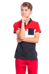 Portrait of pensive teen boy isolated on white background. Thoughtful teenager holding hand near face, looking seriously away at copy space. Beautiful caucasian confident child student.