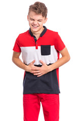 Teen boy with stomachache, isolated on white background. Caucasian young teenager with hands on stomach. Portrait of child having terrible pain in stomach. Diarrhea or gastroenteritis health problem.