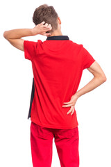 Back view. Teen boy thinking and looking to wall, isolated on white background. Thoughtful teenager in red - rear view. Confused child with his hands on head and waist.