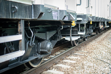 Fototapeta na wymiar Wheels of cargo train on a rail track
