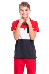 Portrait of happy teen boy showing his teeth. Child smiling and pointing with fingers teeth and mouth. Young teenager, isolated on white background. Concept of good teeth care. Dental health concept.