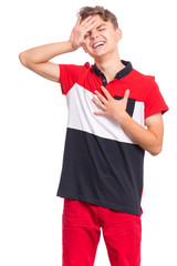 Portrait of tired teen boy touching his head suffering headache. Unhappy beautiful caucasian young teenager suffering from headache. Sad teenager isolated on white background.