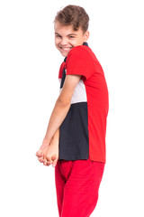 Shy embarrassed teen boy, isolated white background. Smiling shy child in awkward situation. Handsome funny teenager.