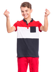 Portrait of handsome young teen boy showing sign symbol of money by fingers, isolated on white background. Smiling child doing rich gesture. Teenager making cash sign gesture rubbing fingers together.
