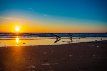 Fototapeta na wymiar Sunset surfers