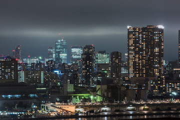 Obraz na płótnie Canvas Panoramic modern city skyline bird eye aerial view of Tokyo bay under rainy night