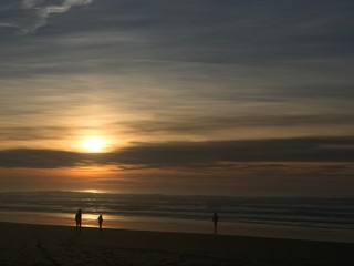 Fototapeta na wymiar Children on the beach at sunset
