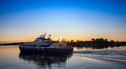 Fototapeta na wymiar Speedboat Vegtind - Sunset in Northern Norway