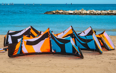group of kitesurfers on the beach of Bari waiting to be used