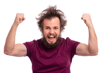 Portrait of happy bearded man celebrating mad and crazy for success with arms raised, isolated on white background. Cheerful male with funny haircut smiling and laughing with fists up. Winner concept.