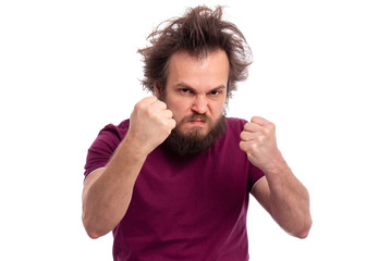 Portrait of adult bearded man showing fist with angry expression, isolated on white background. Crazy male showing fist. Upset and mad caucasian man with funny haircut in rage looking furious.