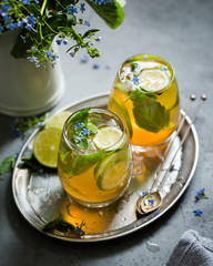 Ice tea with lime, mint and basil