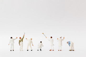 Miniature people : Painter holding a brush with  space for text - obrazy, fototapety, plakaty