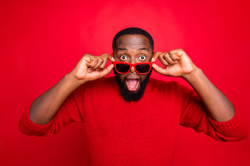 Close-up portrait of his he nice attractive cheerful cheery glad bearded guy putting specs of...