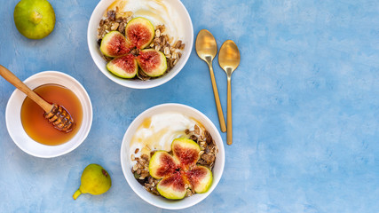 Breakfast with muesli, yogurt, figs in a bowl