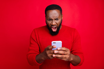 Close-up portrait of his he nice attractive irritated annoyed outraged bearded guy using wireless...
