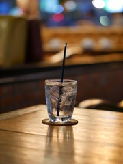 Glass of water drink on the wood table.