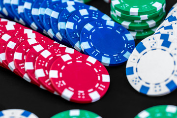 Poker chips close up on black background