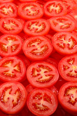 Sliced tomato background. Top view.