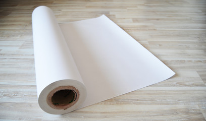 roll of  paper on wooden table