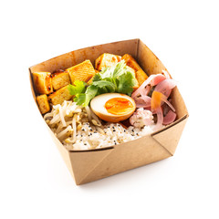 Japanese asian meal in a box of recycled paper isolated on white background.