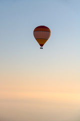 colorful hot air balloon isolated on the sky at  sunrise