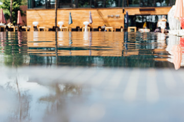 selective focus of swimming pool at resort in sunny day