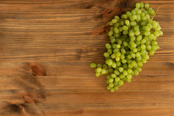 Bunch of Green Grapes on Brown Wooden Rustic Background