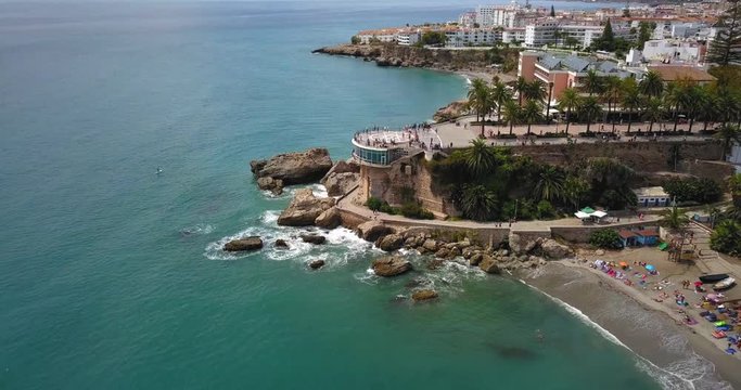 Aerial over the Balcon de Europa in the city of  Nerja, Costa del Sol, Spain. Slow overhead rotating drone footage
