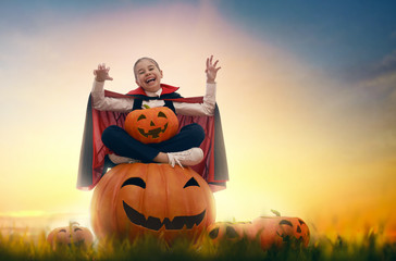 little Dracula with pumpkins