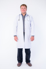 Full body shot of happy overweight man doctor smiling