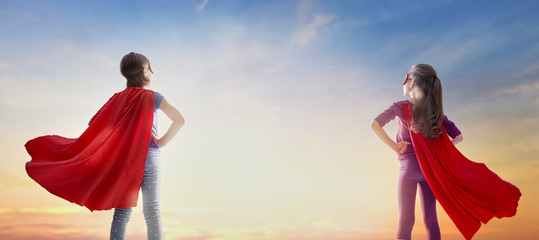 children are playing superhero