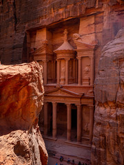 Front facade of the treasury temple of Petra, Jordan, seen from the perspective of a high stone plateau
