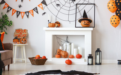 interior of house decorated for Halloween pumpkins, webs and spiders