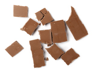 Chocolate pieces, bars isolated on white background, top view